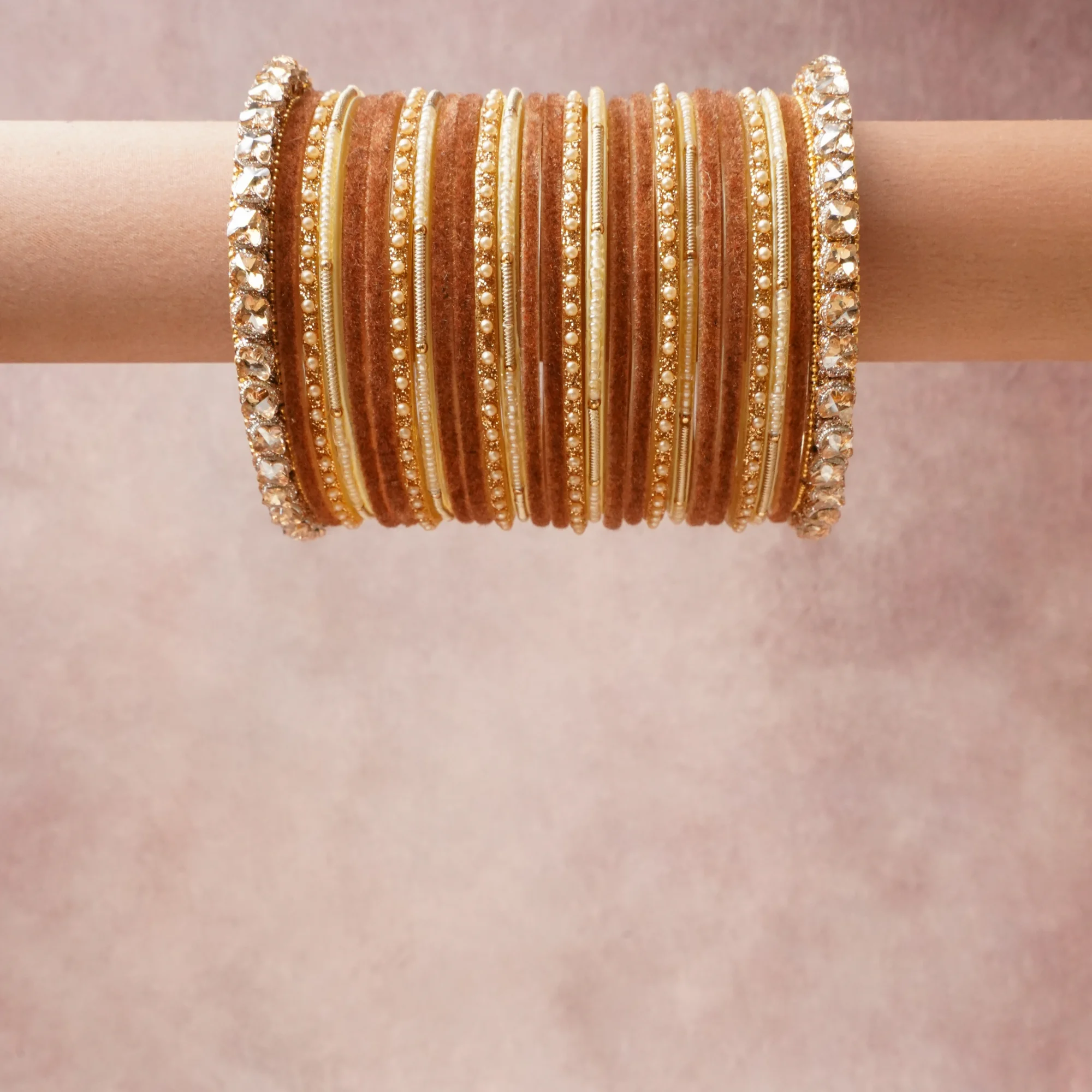 A grounding Rosewood forms the heart of the set, while touches of Warm Gold, Clear Crystal, Cream add charm.

A thoughtful composition of Gold-tone Metal, Velvet Textile, Crystal, Imitation Pearl, Silk Thread, designed to feel complete without being heavy.
Each element layers seamlessly, creating a look that is refined, wearable and quietly striking.